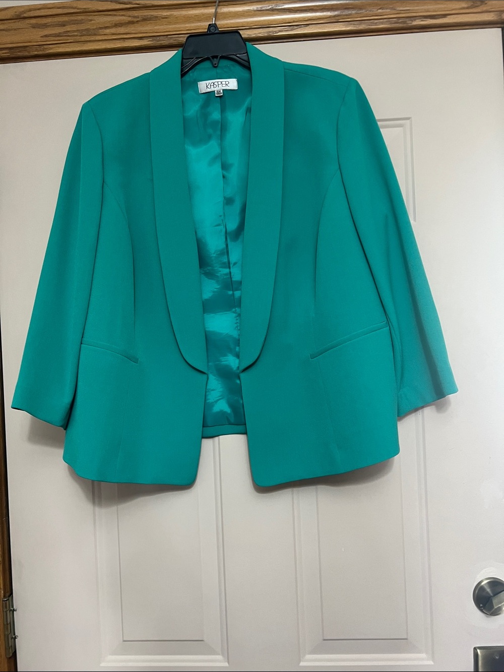 Kasper suit jacket with shoulder pads.